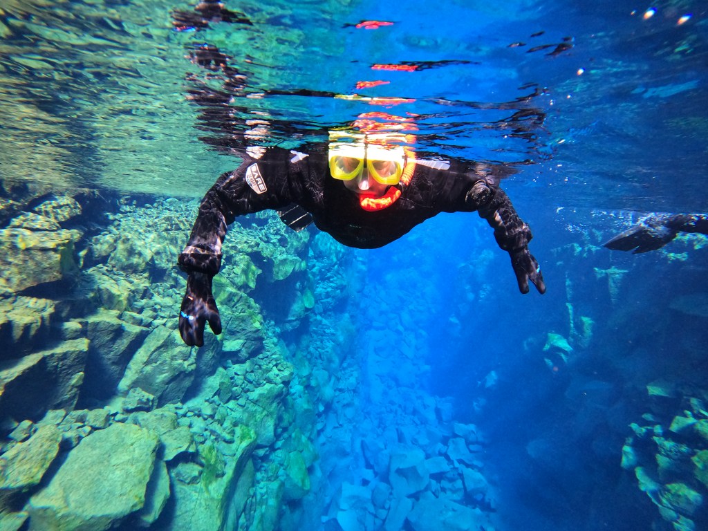 Snorkeling in Iceland. The water was as cold as you think, if not colder...
